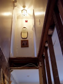 This is the view up from the removed staircase. It was so steep that our dog was leery of going down the stairs. Humans with even medium sized feet had to turn their feet sideways to go down because the treads were narrow.